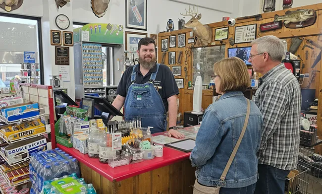 a couple purchasing hardware at the counter